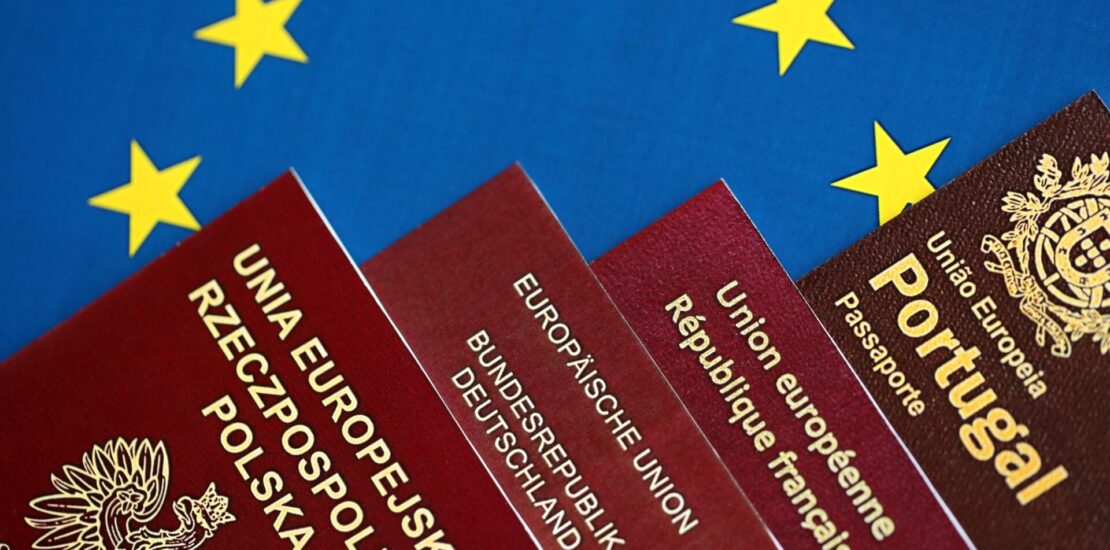 European union countries passports on blue EU flag close up