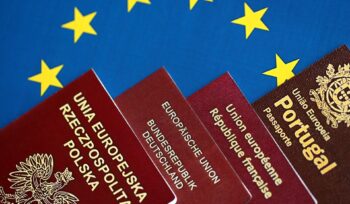 European union countries passports on blue EU flag close up