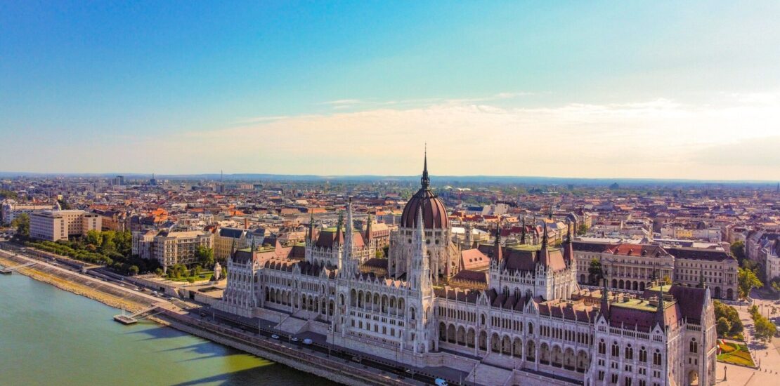 Aerial view of Hungarian Parliament Building reflecting on the river in Hungary