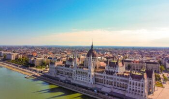 Aerial view of Hungarian Parliament Building reflecting on the river in Hungary