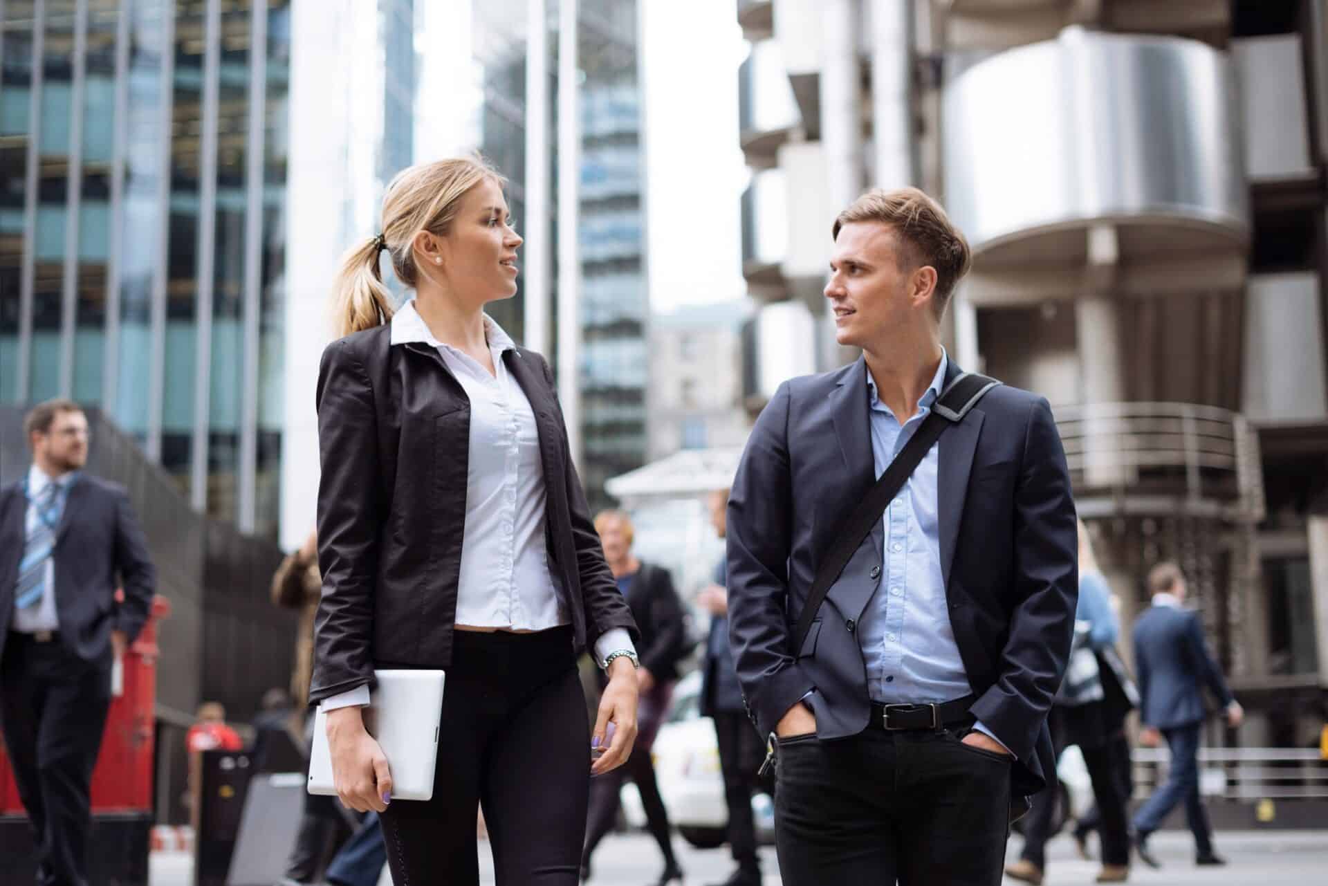 Businessman and businesswoman in city centre, London, UK