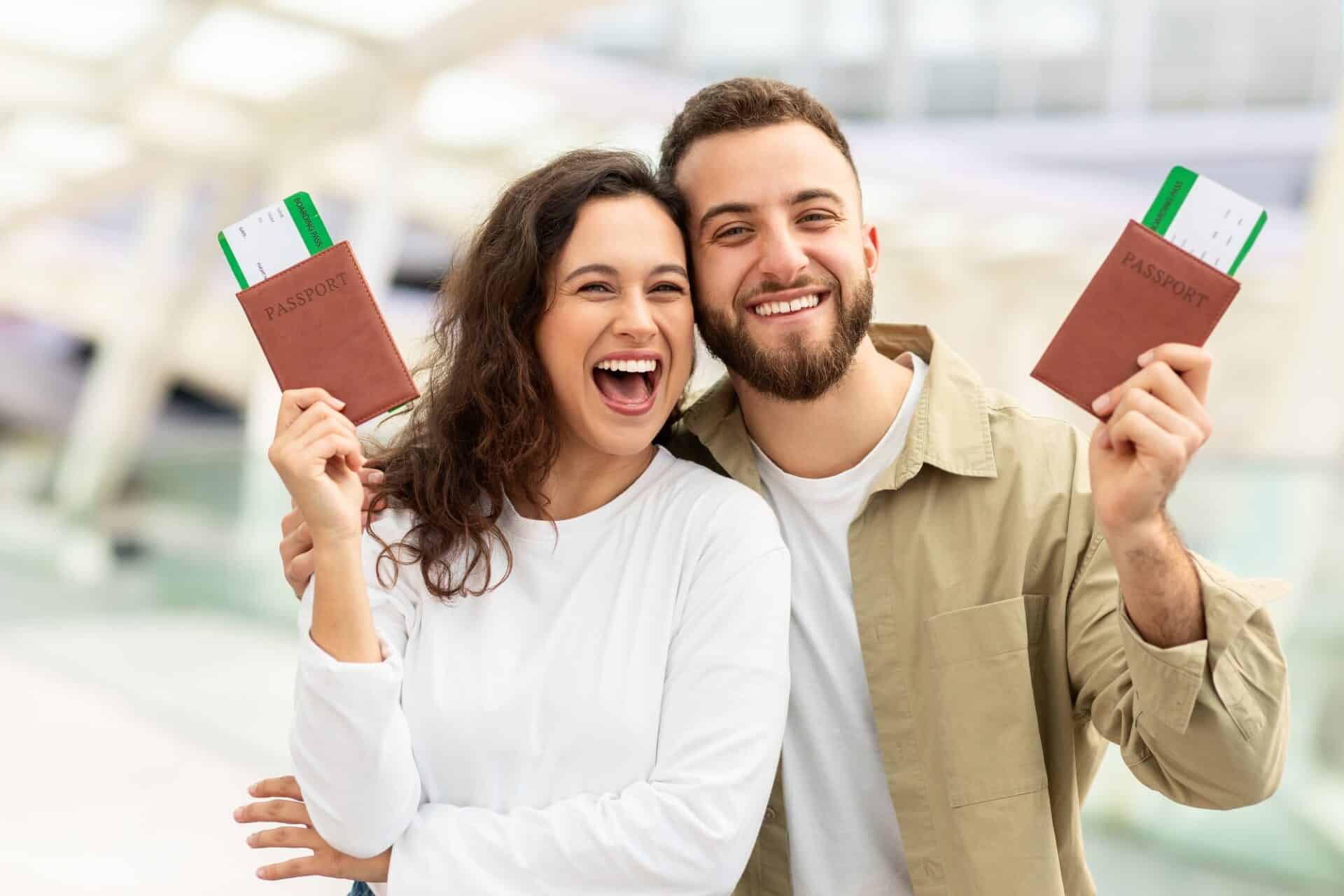 Man and Woman Holding Up Passports In Airport And Smiling At Camera, Services,
