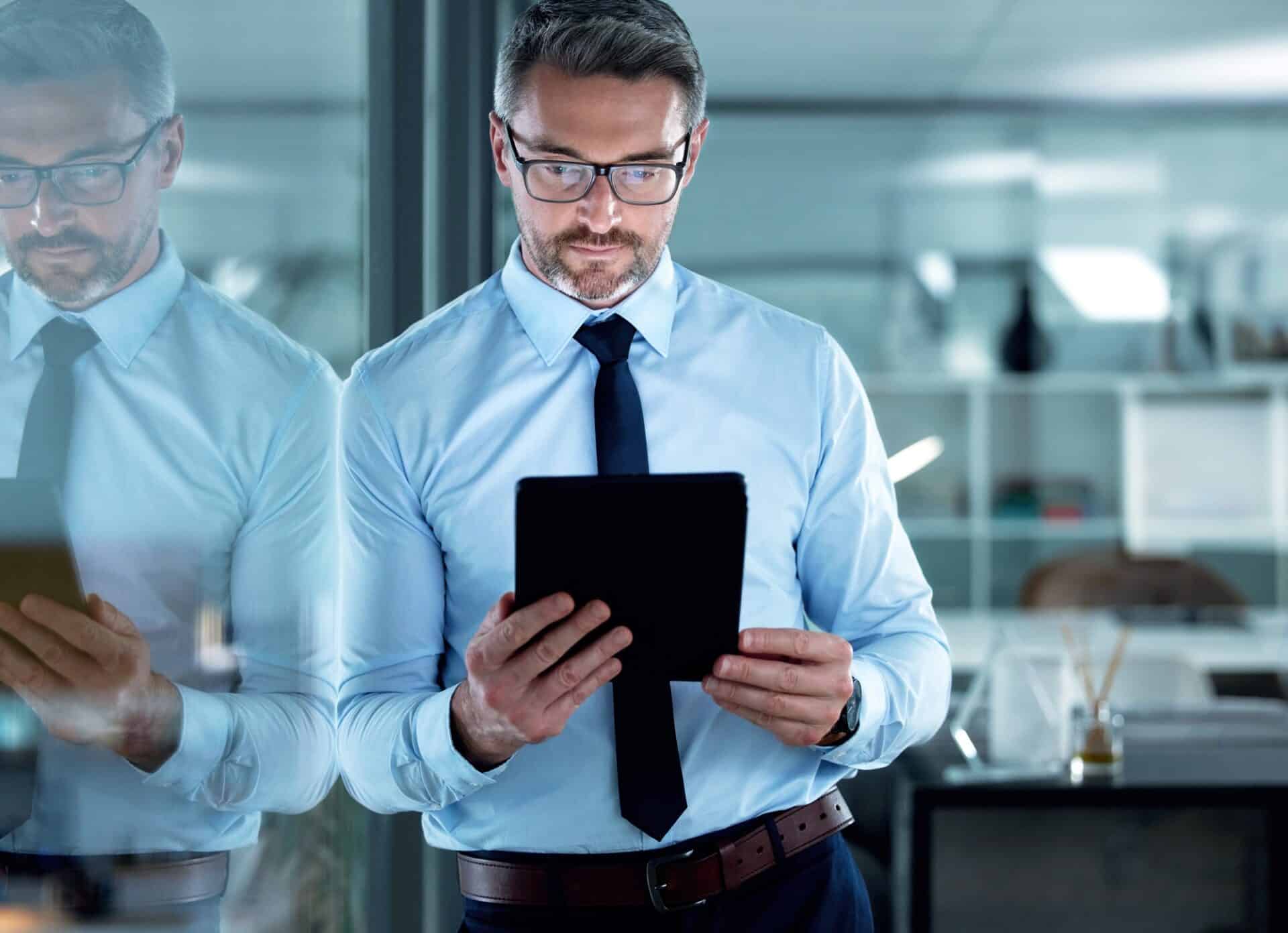 Shot of a businessman using a digital tablet at the office