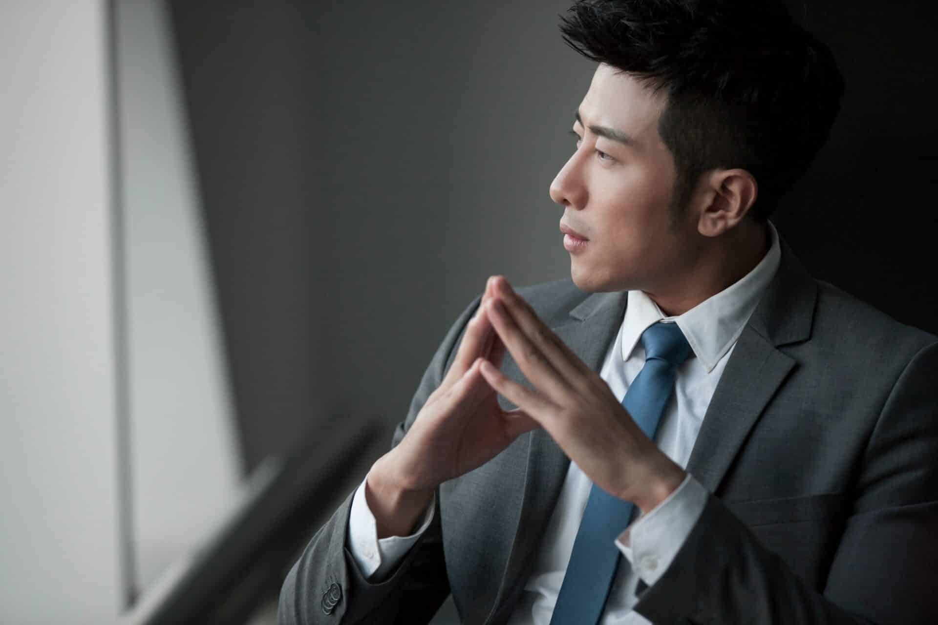 Young businessman thinking