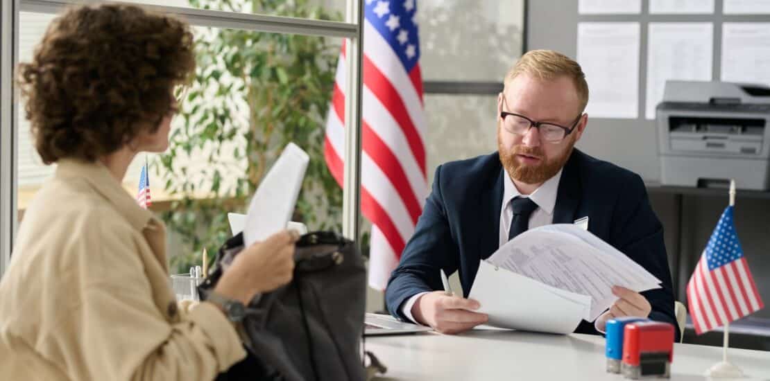 Young woman applying for visa in US immigration office