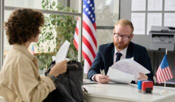 Young woman applying for visa in US immigration office