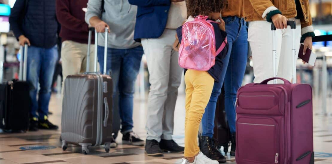 Airport, travel and people legs in queue for international vacation, holiday or immigration. Line,