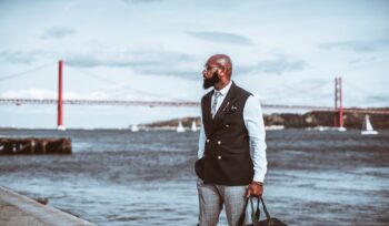 Black elegant guy next to the river