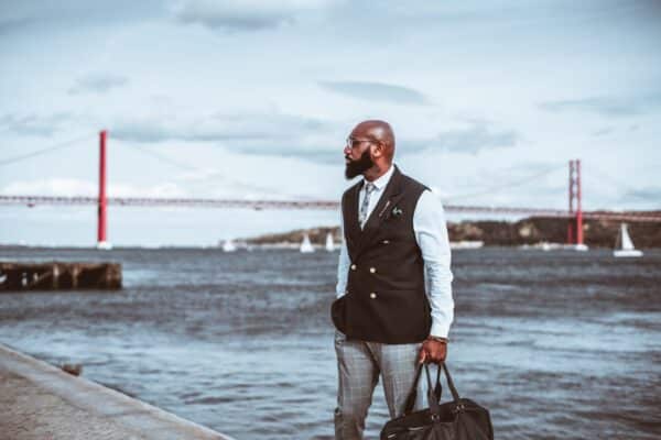 Black elegant guy next to the river