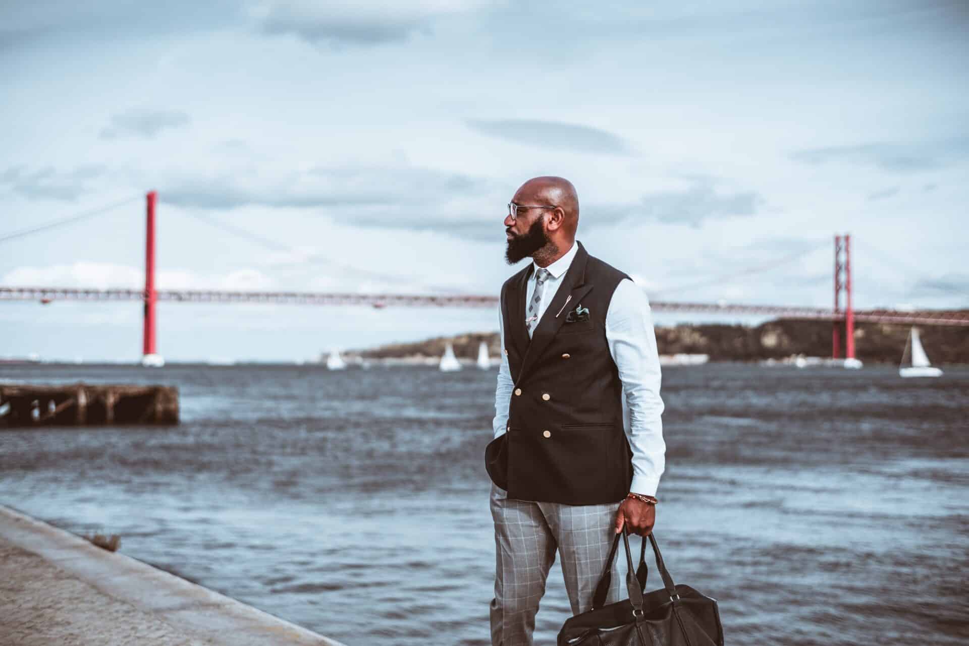 Black elegant guy next to the river
