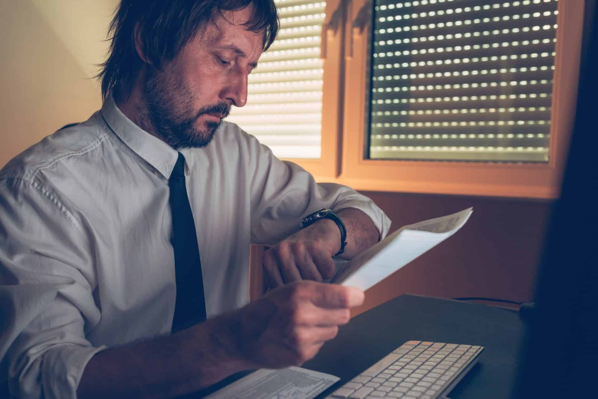 Businessman checking time on his wristwatch