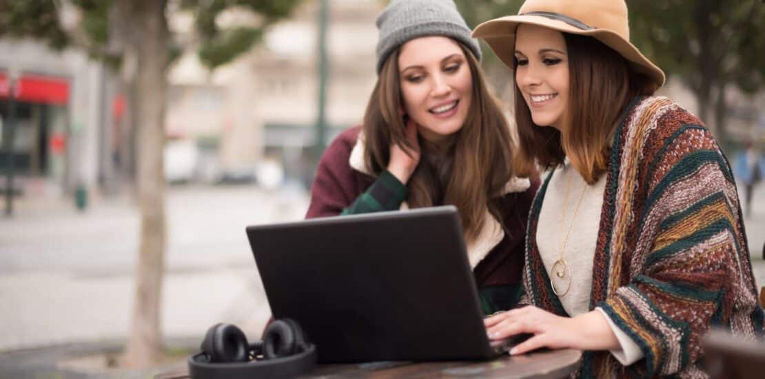 Friends in laptop on street