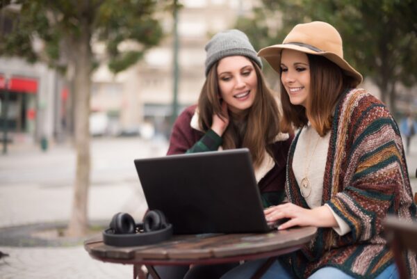 Friends in laptop on street