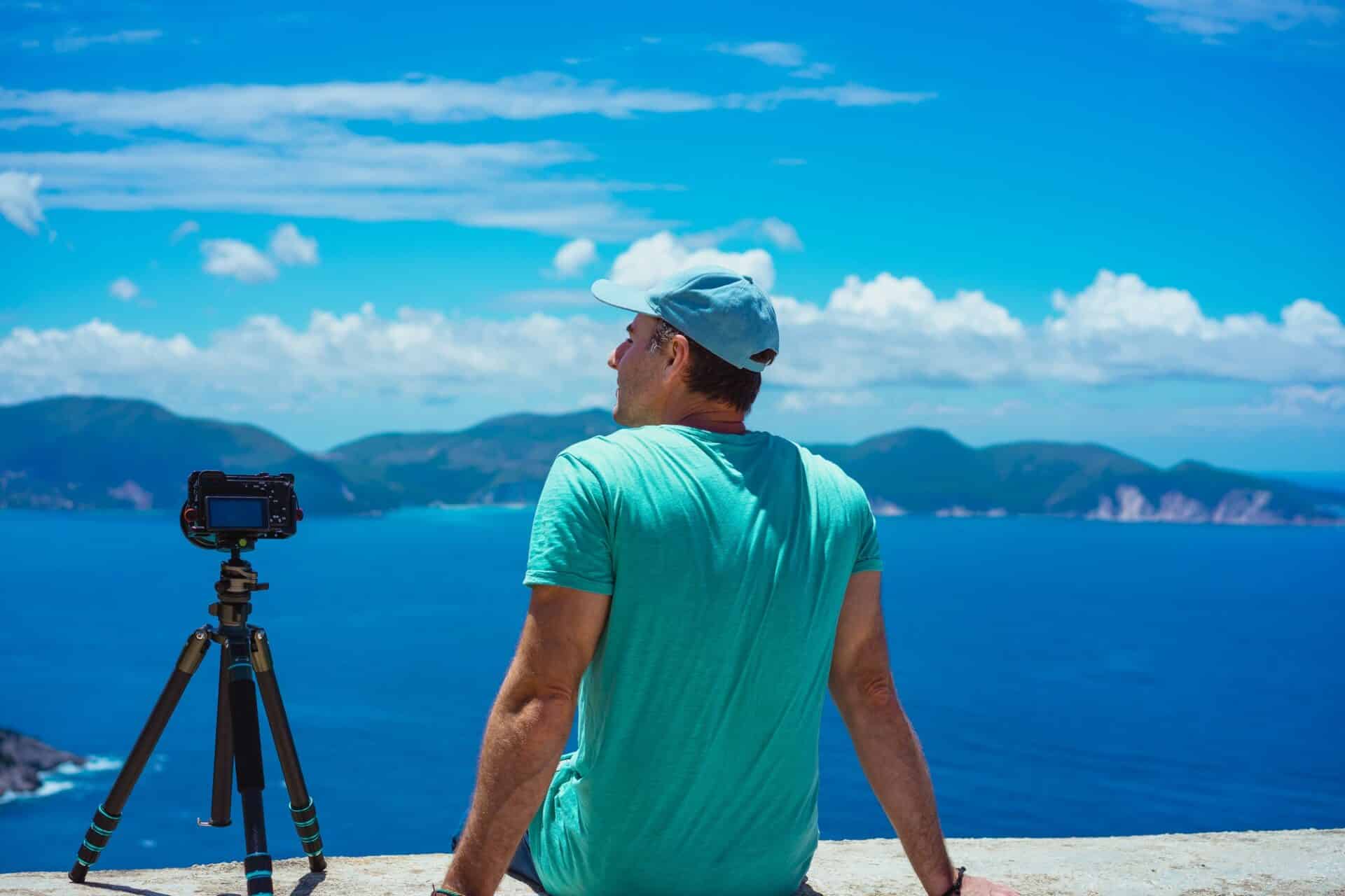 Summer holiday visiting Greece. Male photographer enjoying to capture time lapse cloudscape