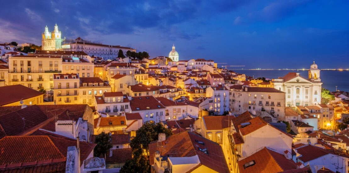 View of Lisbon from Miradouro de Santa Luzia viewpoint at evening. Lisbon, Portugal