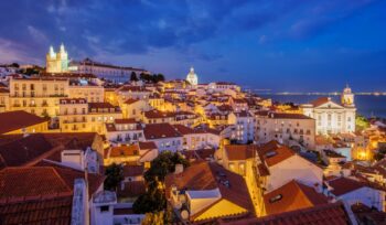 View of Lisbon from Miradouro de Santa Luzia viewpoint at evening. Lisbon, Portugal