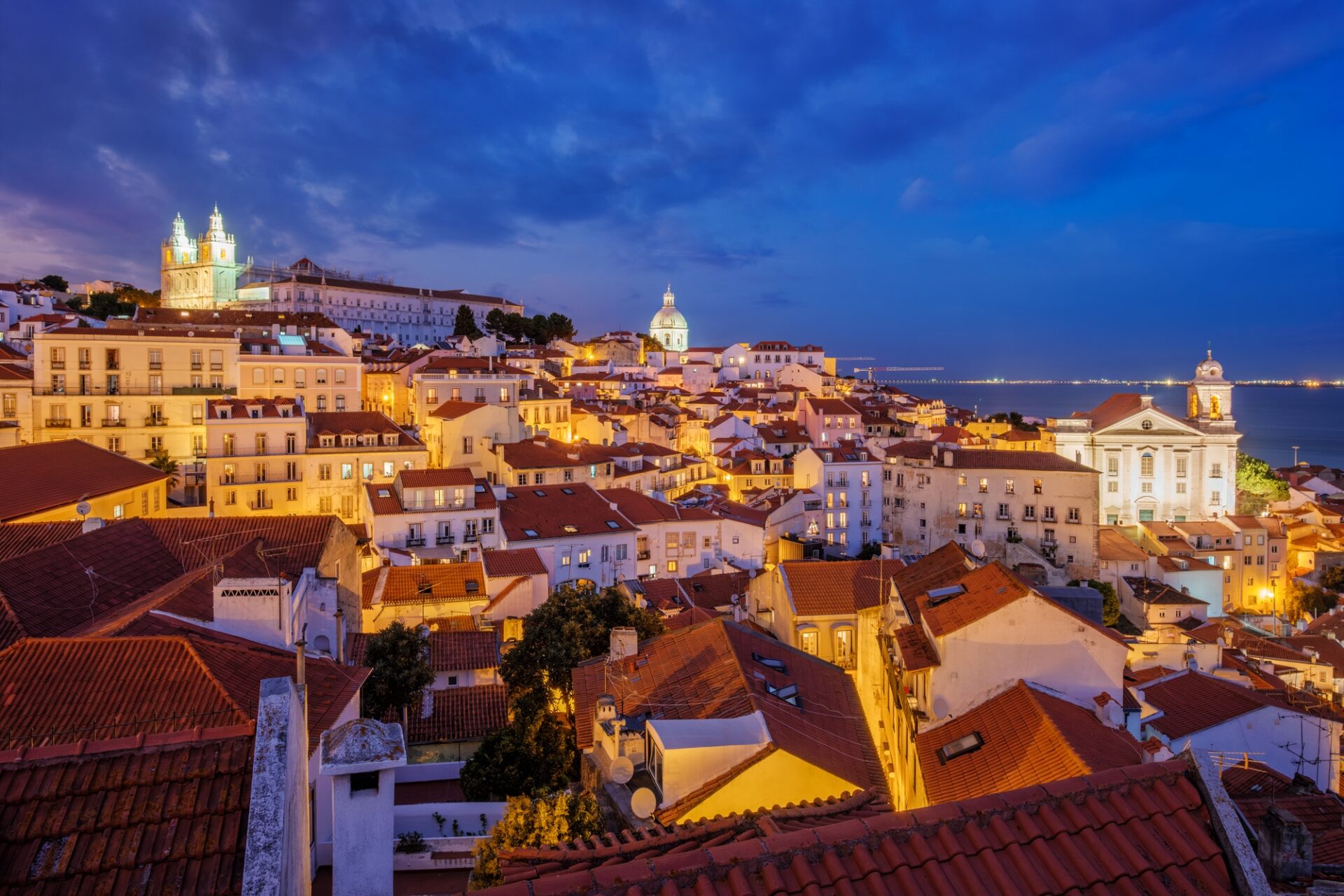View of Lisbon from Miradouro de Santa Luzia viewpoint at evening. Lisbon, Portugal