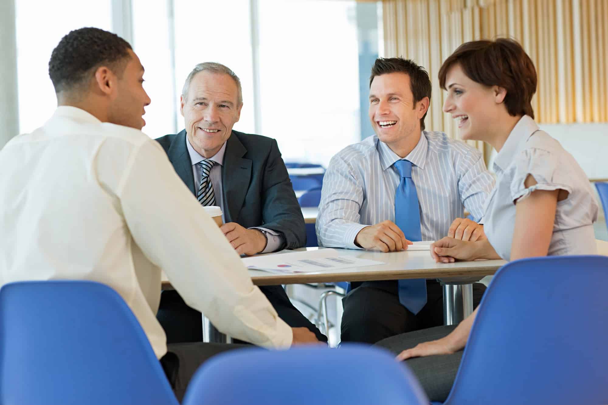 Smiling businesspeople in meeting